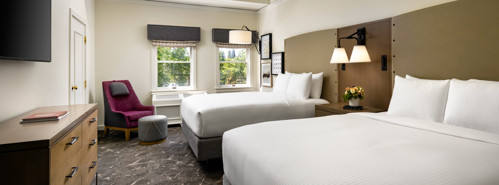 bedroom with two beds and small sitting area