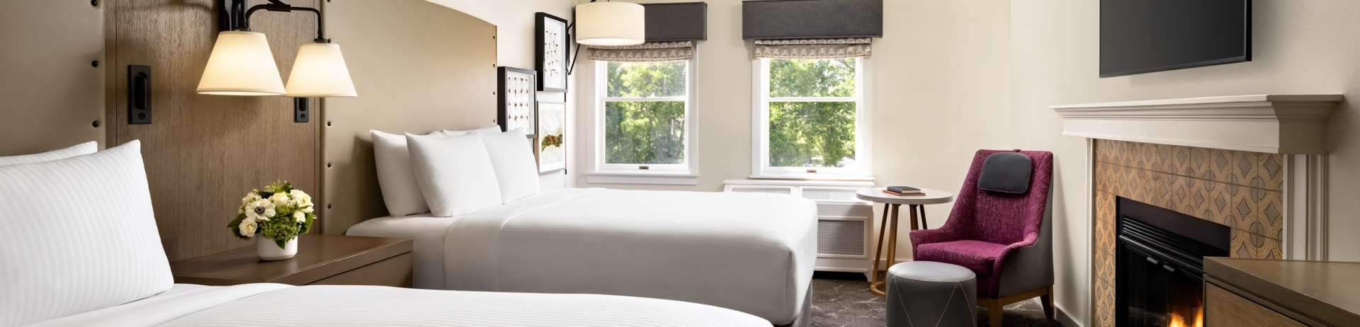 bedroom with two beds and a sitting area