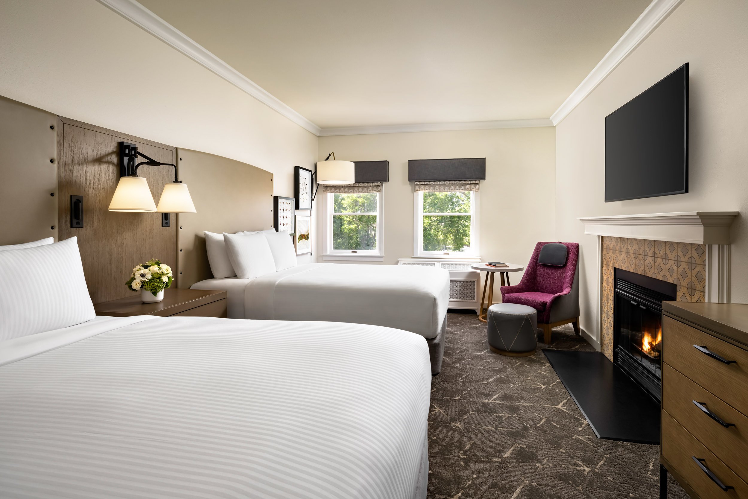 bedroom with two beds and a sitting area