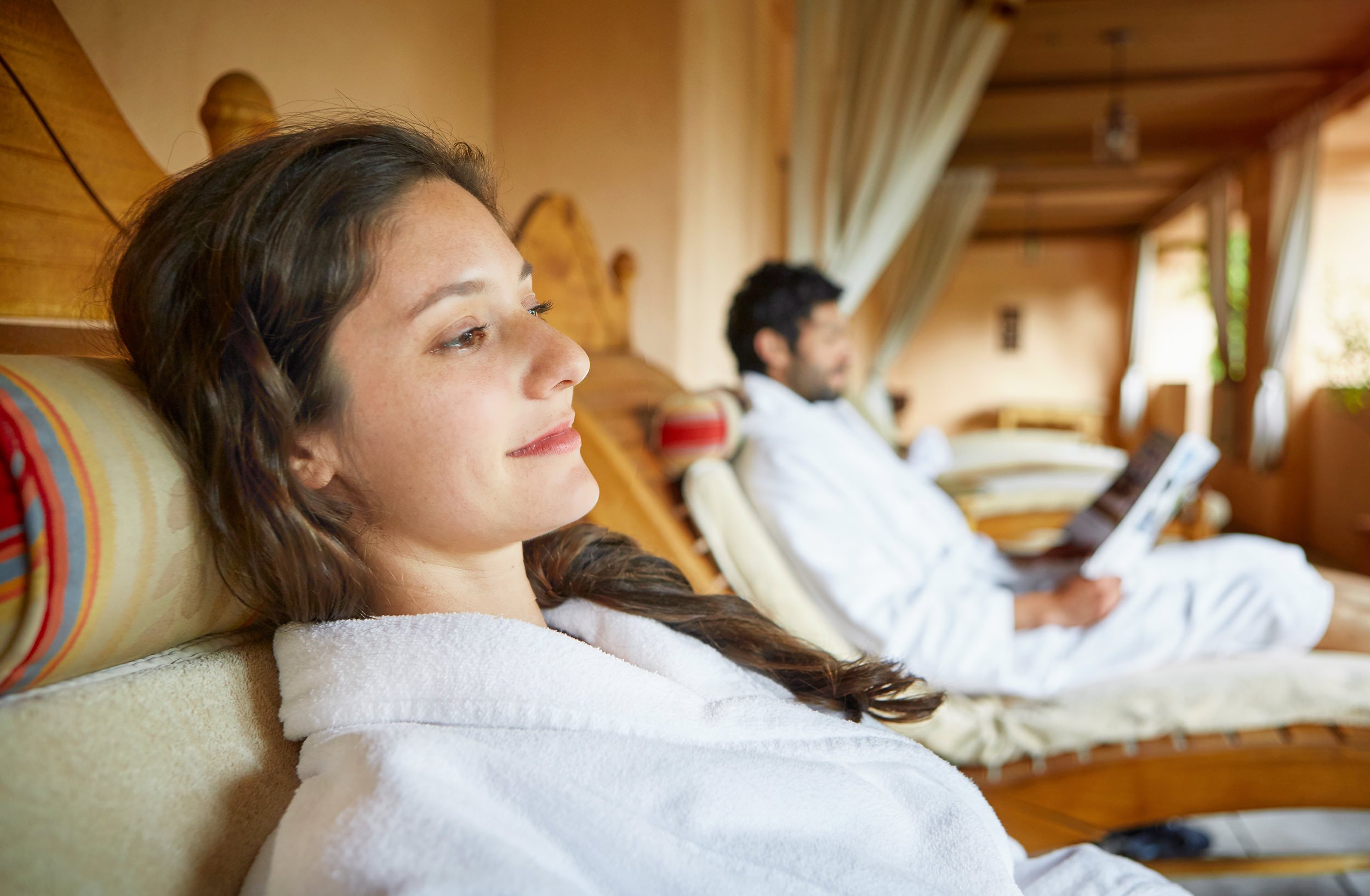 A couple lounging in robes