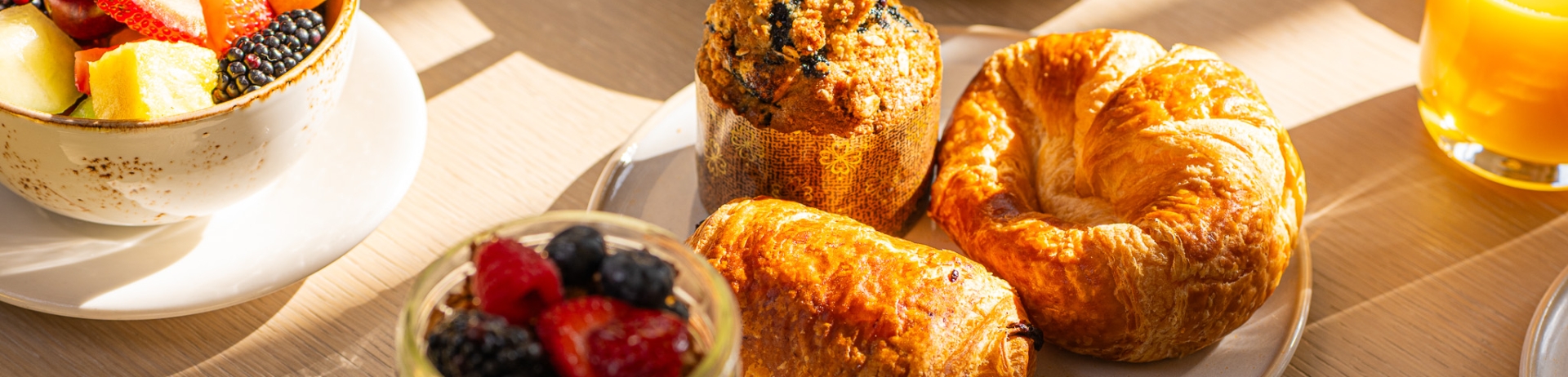 Table with plate of freshly baked pastries with sunlight hitting the table at Santé Restaurant