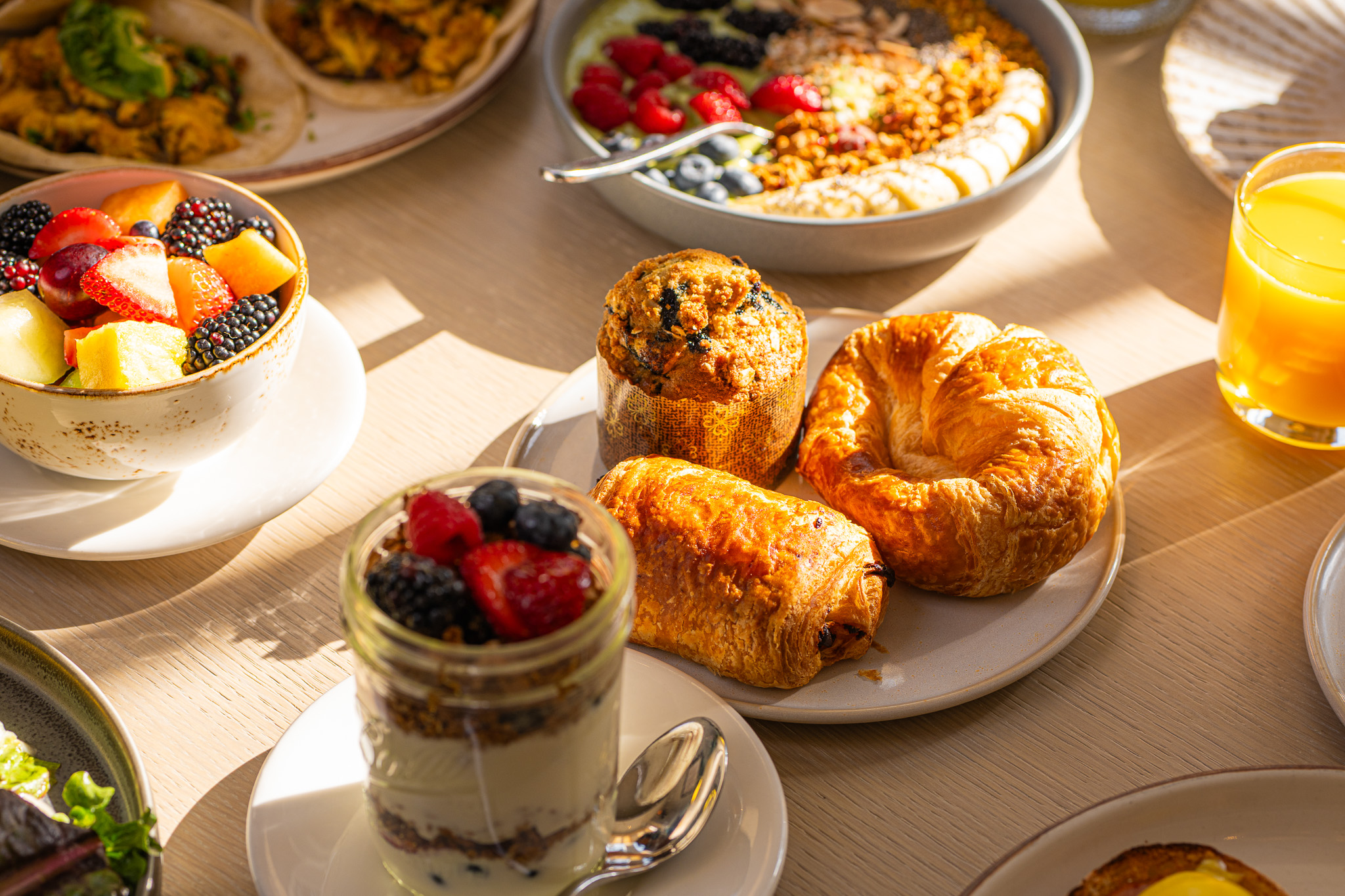 Table with plate of freshly baked pastries with sunlight hitting the table at Santé Restaurant