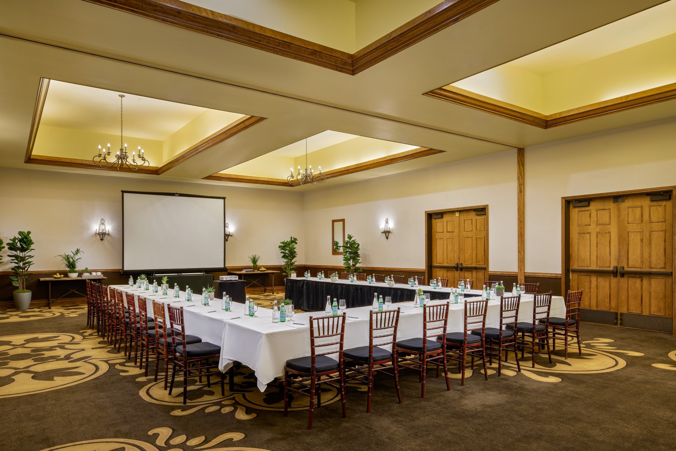 meeting room at fairmont sonoma with u-shape table and chairs facing a projection screen
