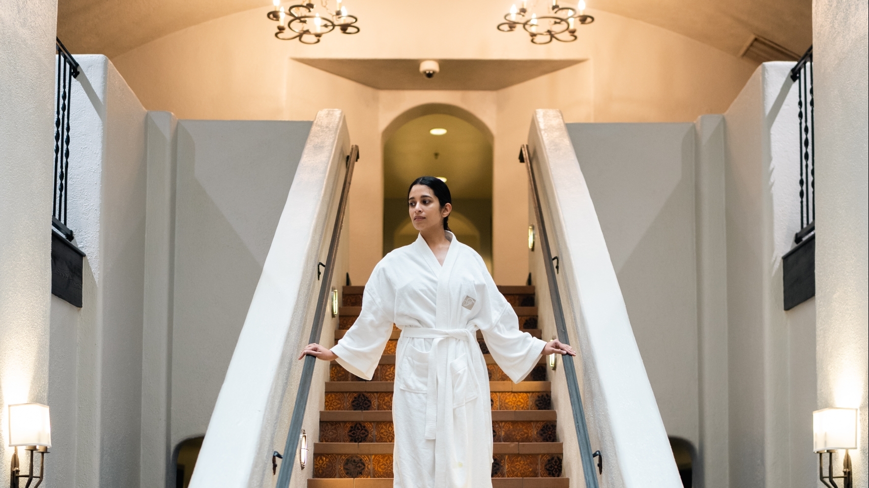 woman walking down staircase