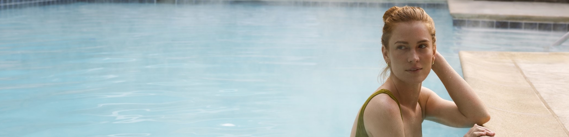 woman standing in pool