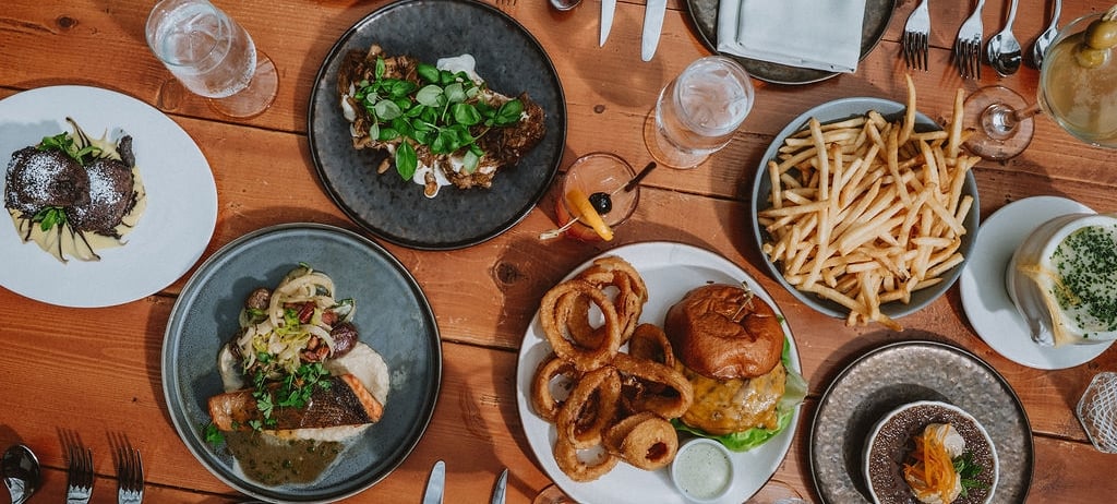 table full of delicious food items