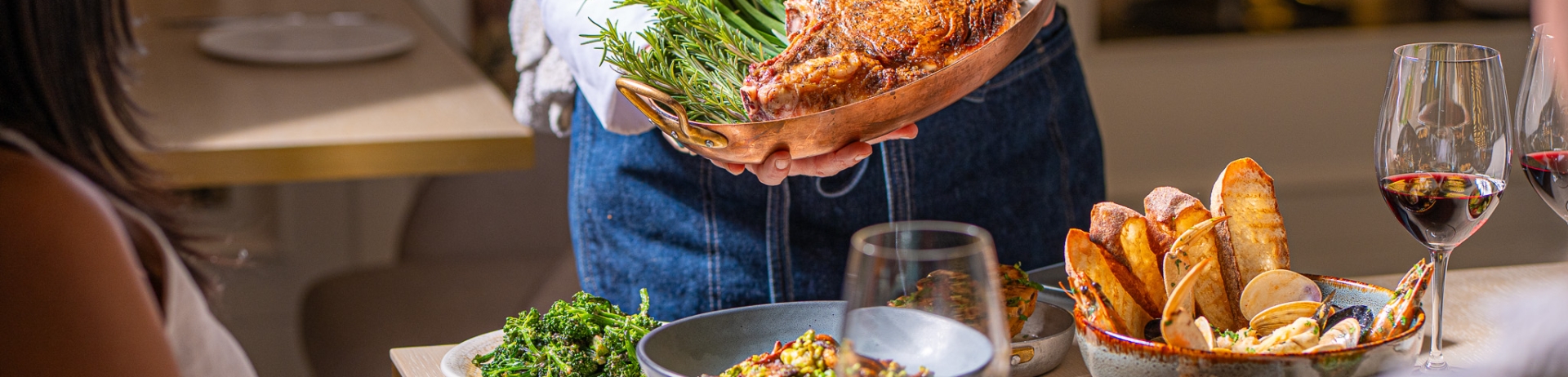 Chef presenting a large platter of brightly colored food